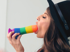 Mom Madison Ivy in black hat and stockings shoves striped dildo in mouth