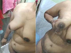Slutty desi girl enjoys bathing time and playing her big dark brown nipples