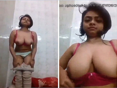 Insanely hot Desi woman with amazing boobies is playing with her goods XXX