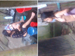Indian woman enjoys outdoor bathing and washes her clothes in front of a Hidden Cam