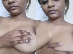 Desi whore with a natural pair of boobs is holding the camera and goes XXX