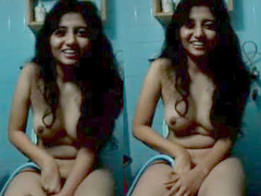 Adorable Desi teen with natural boobs is smiling while recorded by the XXX cam