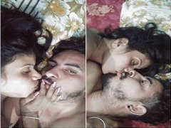 Desi couple laying in bed and kissing as a way to start the action into XXX