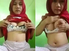 Cute Desi with massive natural boobs and a great body wears a hijab for XXX