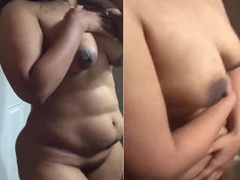 Natural Desi woman with big boobs and a fat bum dances XXX dances while shy