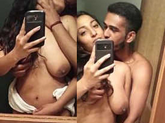 Desi nri couple is kissing and groping in front of the mirror for some XXX