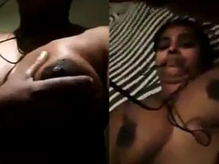 Video call where a Desi aunty is fondling her very juicy XXX boobs all alone