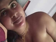Married Desi aunty lays naked in bed and she is talking to someone about XXX